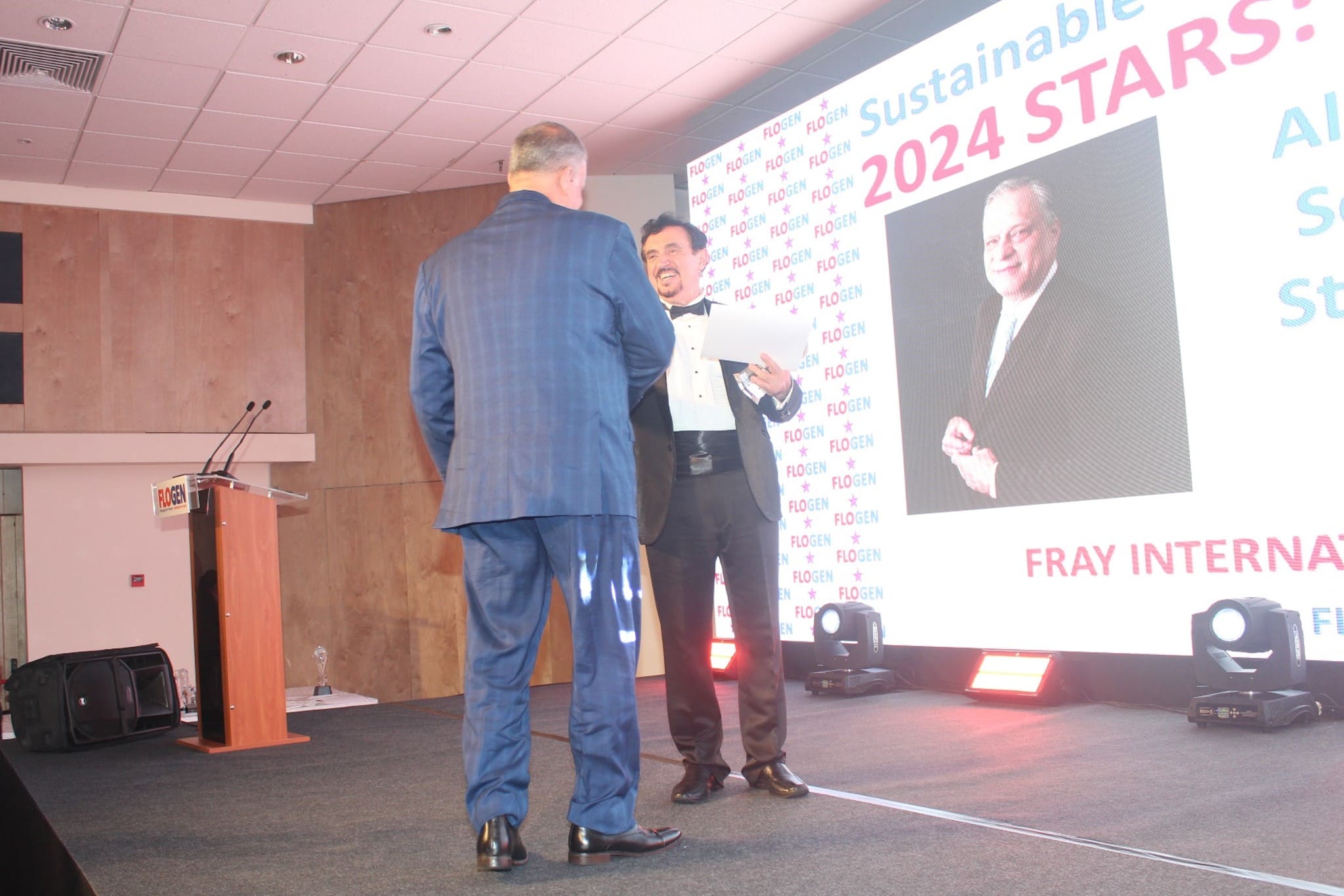 Dr. Florian Kongoli congratulating Mr. Alexandre Meyohas during the FLOGEN SIPS 2024 award ceremony