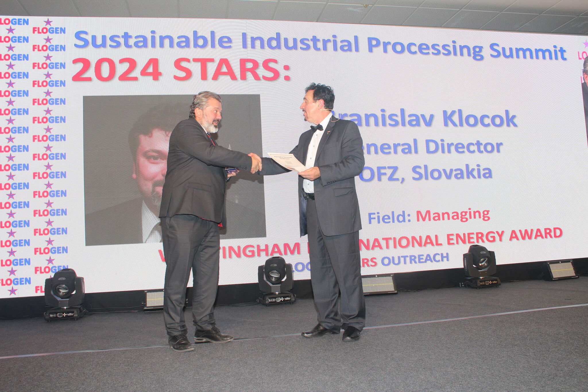 Dr. Florian Kongoli congratulating Mr. Branislav Klocok during the FLOGEN SIPS 2024 award ceremony