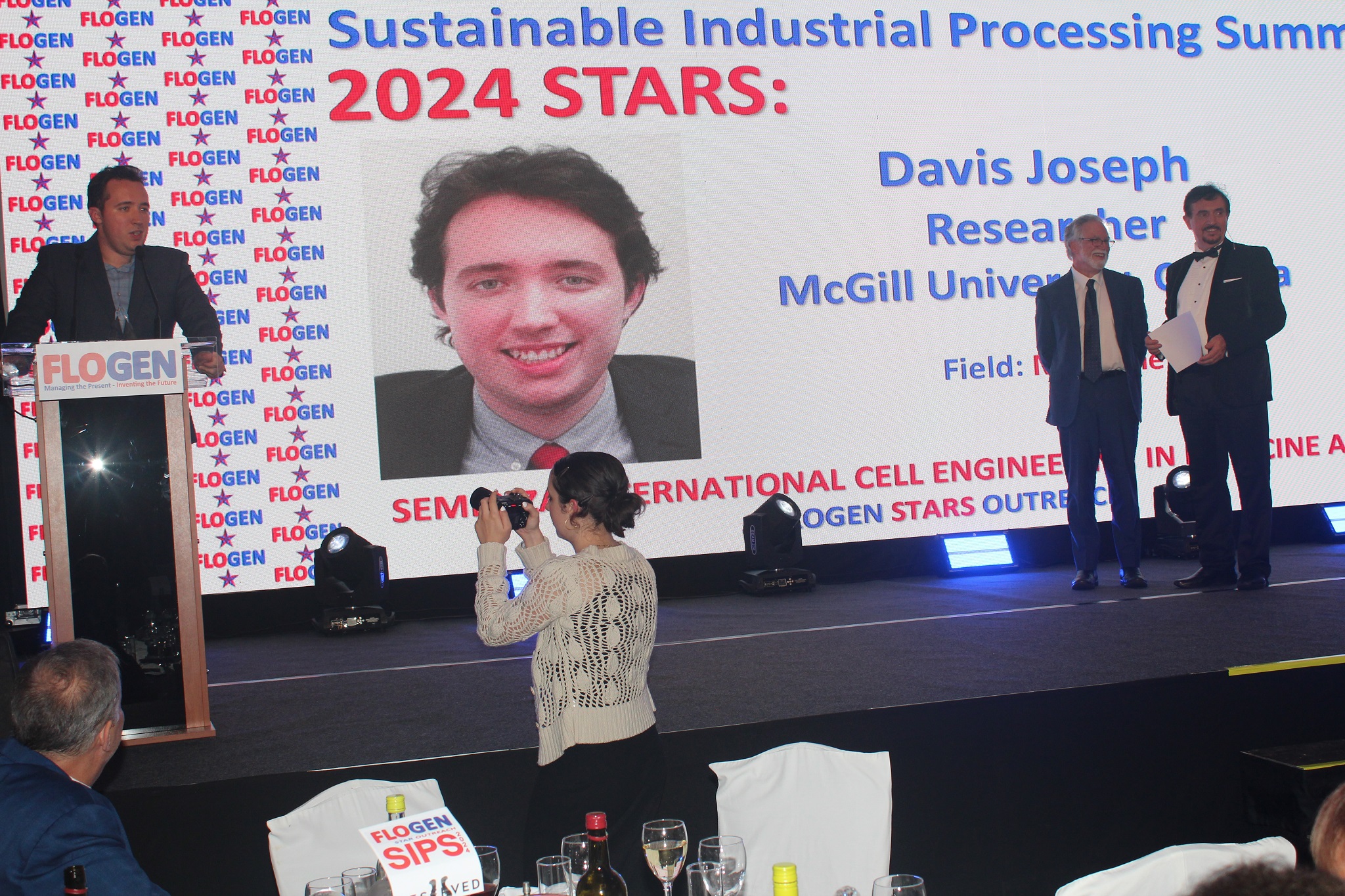 Davis Joseph delivering an acceptance speech during the FLOGEN SIPS 2024 award ceremony