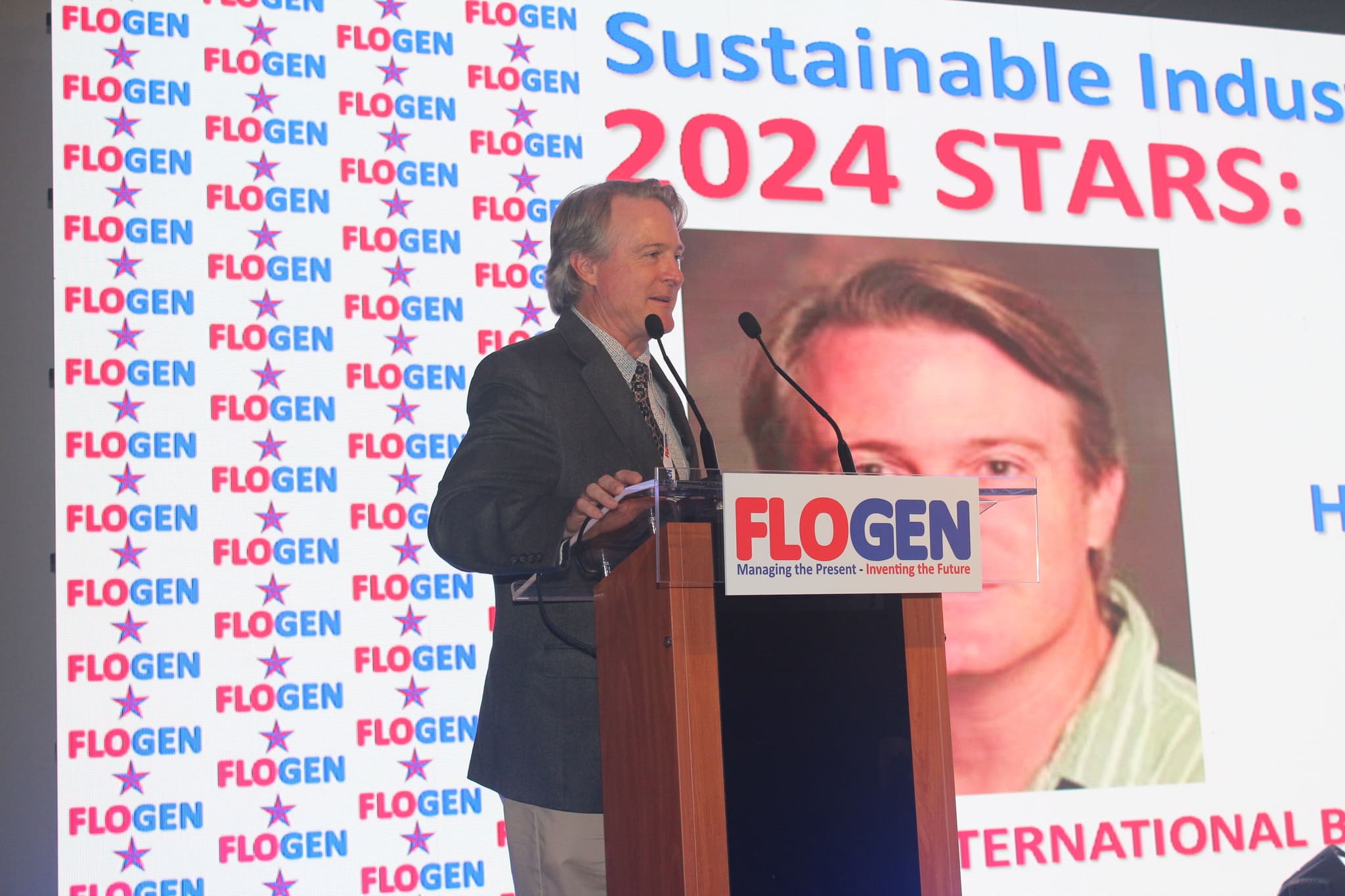 Dr. Frank J. Slack delivering an acceptance speech during the FLOGEN SIPS 2024 award ceremony