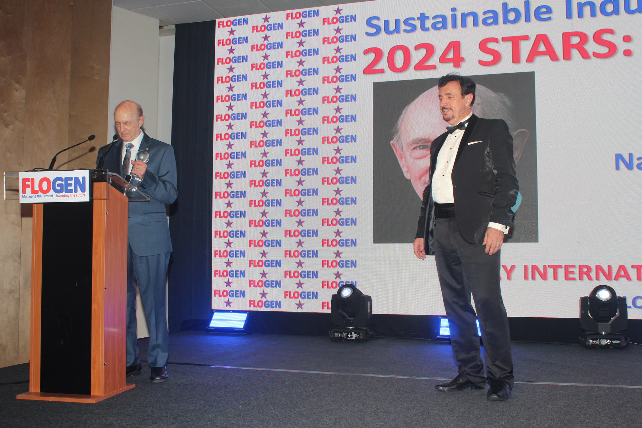 Dr. Harvey J. Alter delivering an acceptance speech during the FLOGEN SIPS 2024 award ceremony