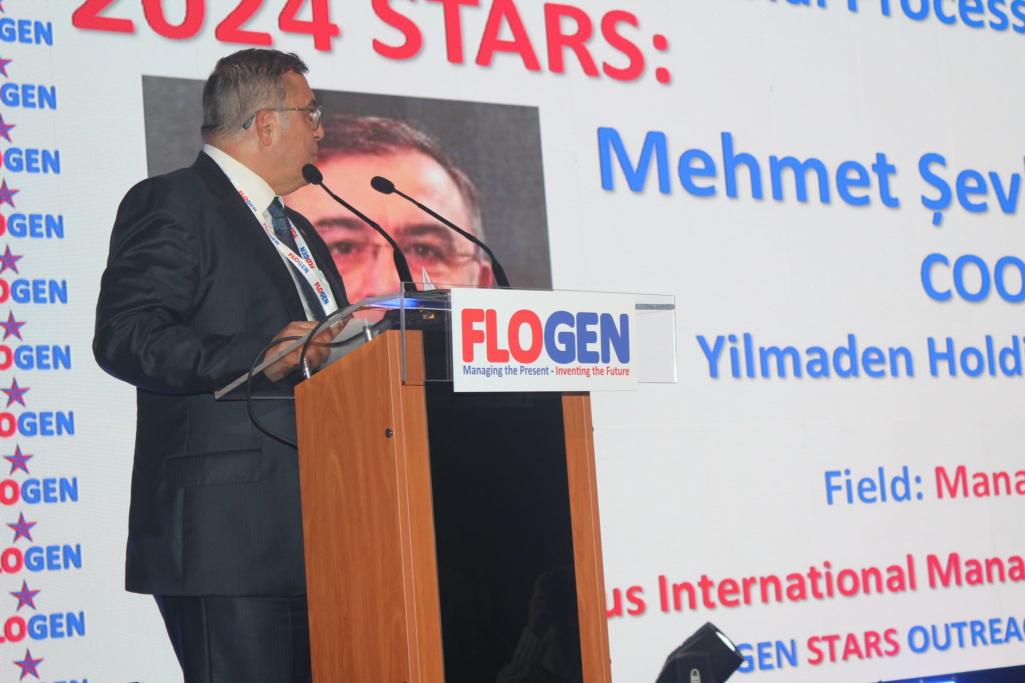 Mr. Mehmet Şevket Erol delivering an acceptance speech during the FLOGEN SIPS 2024 award ceremony