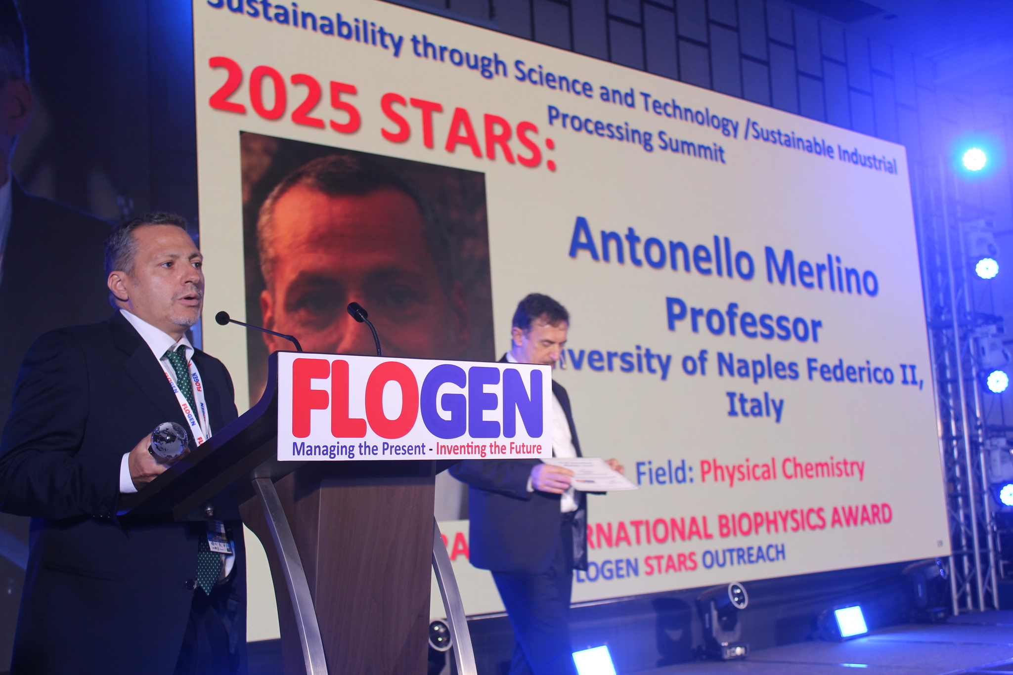 Dr. Antonello Merlino delivering an acceptance speech during the FLOGEN SIPS 2025 award ceremony