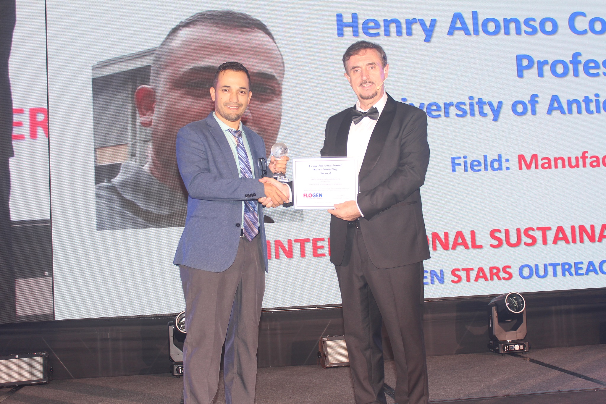 Dr. Henry Colorado receiving the Fray International Sustainability Award from Dr. Florian Kongoli at FLOGEN SIPS 2025