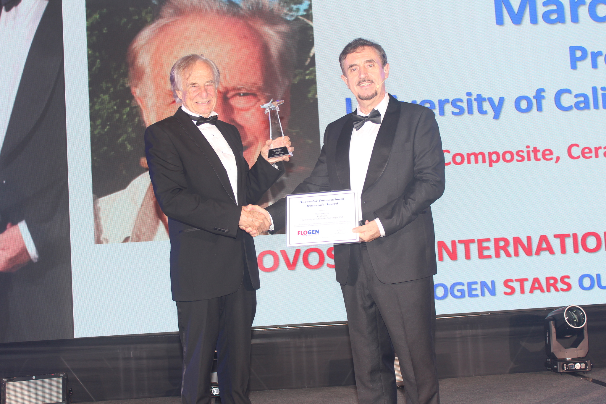 Dr. Marc Meyers receiving the Novoselov International Materials Award from Dr. Florian Kongoli at FLOGEN SIPS 2025